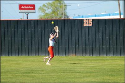 Grab and go Cushing Lady Tiger outfielder Romy Withiam makes a catch during the Lady Tigers game against the Chandler Lady Lions. Cushing destroyed Chandler 14-4 in four innings. Photo by J. D. Meisner