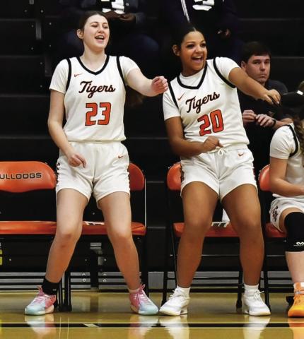 Lady Tigers Tirzah Wade and Makiah Shanklin take full advantage of a good reason to dance as the Lady Tigers put together a complete game and defeated the Yale Lady Bulldogs 58-21 last Thursday, in Yale. See story inside. Photo by Sarah Townes.