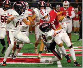Jordan Kersey tackles a Ft. Gibson runner. Photo by Sylvia Danyele