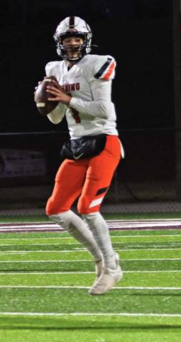 Blaze Berlowitz under the lights in Blanchard Friday. He threw for 180 yards and two touchdowns against the Lions.