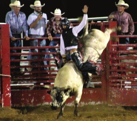 Donald Holmes, from Geronimo, holds on tight trying hard to meet that eight second qualifying time for bull riding on July 16.