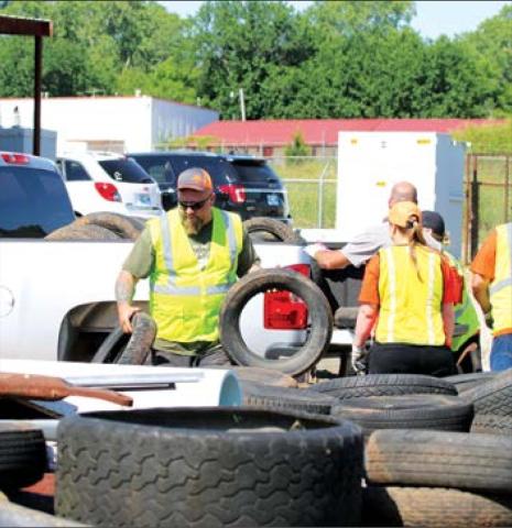 Cushing City Emplopyee Jeremy Brown unloaded tires at the city yard.