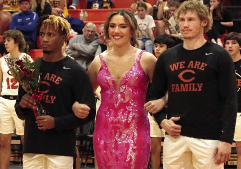 Noah Jones and Camden Crooks escorting Tatum Caulfield.