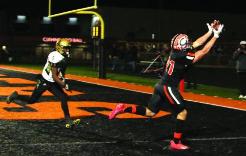 Camden Crooks catches a perfect pass from quarterback Blaze Berlowitz for another Cushing touchdown Friday. Photo by J. D. Meisner