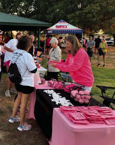 Pictured at the Enid breast cancer awareness event, Shyla Eggers promotes Stillwater Medical Center. After years of helping share patient stories, Eggers recently found herself navigating her own health journey with sleep apnea.