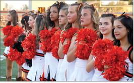 The Tiger spirit squad listens to the National Anthem. Photo by Sylvia Danyele