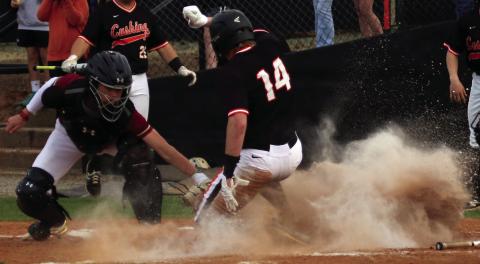 Statler Ethridge slides into home while dodging the Lincoln Christian catcher’s glove. Photos by Allie Prater