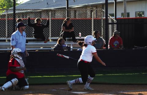 Everybody watches Ava Hebensberger’s solo home run gain altitude. Where did it go? Read the story on page 5 to find out. Photo by J. D. Meisner