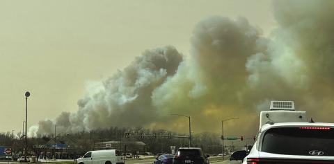 Wildfires burn thousands of acres, dozens of homes