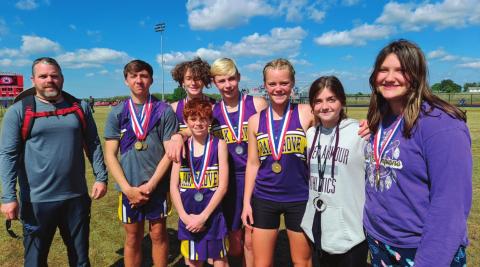 Oak Grove’s Track team came home from the recent ORES State Track meet with three state champs and a lot of podium finishes. Pictured rom left are, Coach Nate Walker, Klayton Kinnin, Tony Six, Cole Cooper, Cora Eyler, Mya Bridgeman, and Hailee Allen. In the front is Owen Collier.