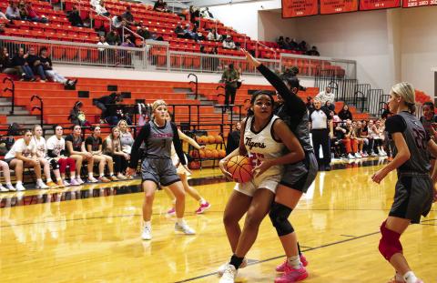 Makiah Shanklin hooks an elbow and gets past a Kiefer defender. Photo by J. D. Meisner