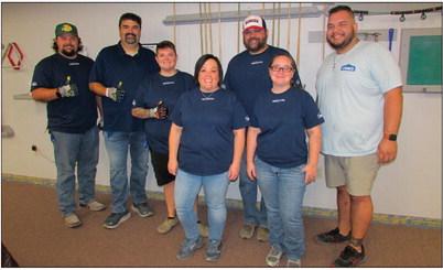 Volunteers came to the Cushing Senior Citizen Center as part of Lowe’s Red Vest Volunteer Day last Friday to provide updates such as installing new baseboards to match the new coat of paint throughout the building.