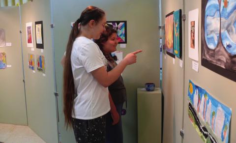 Brooklyn Park and Bonnie Hamm enjoy a painting at the Lachenmeyer Arts Center.