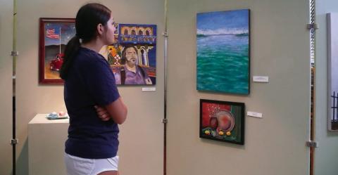Timbraly Shadowen views the exhibit