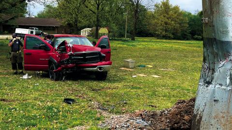 Members of the Cushing Fire Department and EMS work the scene of a truck vs power pole accident in Ninth Street last week. The driver of the truck was seriously injured and flown to OU Medical Center in Oklahoma City. Photo by J.D. Meisner