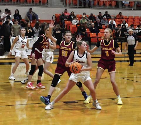 Emory Turner looks for an open teammate after pulling down a rebound. Photo by Sarah Townes