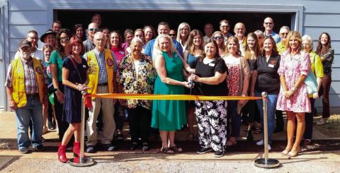 Several volunteers and vested community members turn out for the Payne County Youth Services ribbon cutting for the fitness center at the Emergency Youth Shelter.