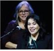 Elvia Bustos accepts the Cushing Chamber of Commerce Small Business of the Year Award while Vera Huckabay offers congratulations. Photo by J. D. Meisner