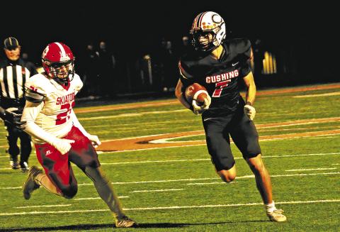 Cushing’s Roman Tucker turns up field en route to a first down Friday against Skiatook.