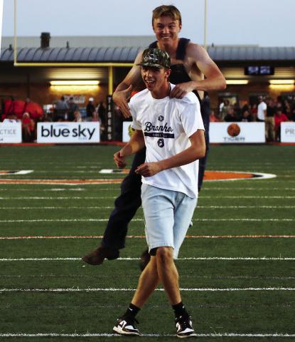 Maddox Morris is congratulated by Jake Collier after Morris successfully kicked a field goal during the Golden Chick’s “Kickin’ for Chicken” contest at halftime of Friday’s Berryhill game. Morris won a 12-piece chicken for his efforts and Collier, who was the holder, probably got a couple pieces. Photo by J. D. Meisner
