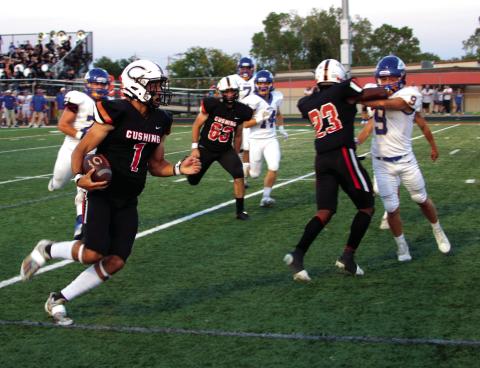 Tiger quarterback Blaze Berlowitz heads for the goal line on a Red Zone touchdown run.