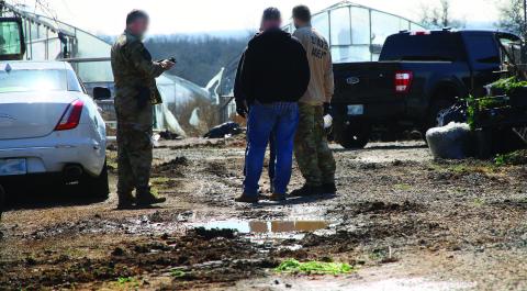 Oklahoma State Bureau of Narcotics agents working the crime scene during a raid of an illegal marijuana grow farm on SH-51 just west of Yale. Photo by Allie Prater.