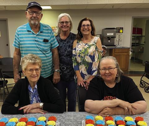 From left: Charles Beaver, Project H.E.A.R.T. Site Director Debbie Franklin, and SCC Director Debbie Brown stands behind Elma Fox and Catherine Johnson sitting.