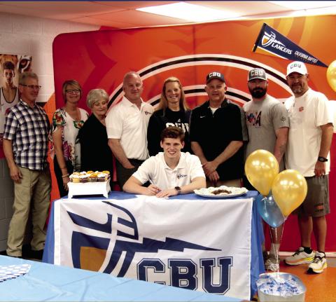 Cushing Tiger and OSSAA Class 4A state champion wrestler Kaiser Simpson signs his letter of intent to attend California Baptist University on a wrestling scholarship. On hand to congratulate Kaiser were hi uncle Bruce Crain, aunt Joanne Crain, Mimi Barbara Rollins, dad Dr. Kasey Simpson, mom Laura Simpson, Tiger Wrestling Head Coach Barry Patterson, Coach Josh Meyers, and Tiger wrestling coach Kyle Fry. Simpson will wrestle for for the CBU Lancers, a Big 12 wrestling program. Photo by J. D. Meisner