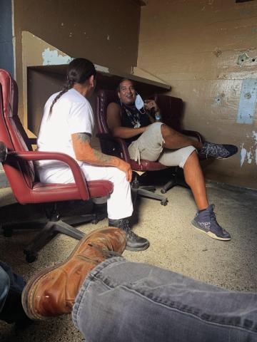 Cushing alumnus Dan Warrior, sits with Danny Trejo in the middle of the production of upcoming movie “Seven Cemeteries”. Warrior will play the role of a henchmen who throws a zombified Efren Ramirez into a wood chipper.