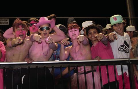 Tiger fans Jagger Willing, Cole Vaughn, Clay McKiddy, Andy Collier, Daniel Hernandez, and Gage Lovin celebrate Cushing’s third touchdown of the night as the Tigers shut out Wagoner Friday during the Breast Cancer Awareness, pink-out game.
