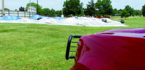 Once the shells and shot boxes were fully set up the Cushing Fire Department covered them with a tarp, set up a perimeter, and kept a department member on site to keep a watchful eye on the equipment. Photo by DeAnna Maddox
