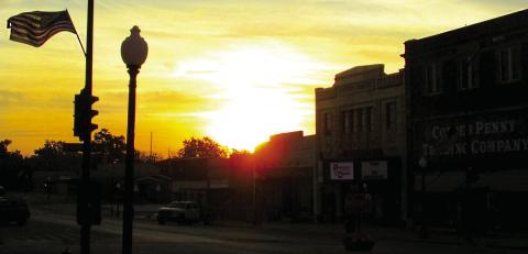 The sun peaks up over the buildings in Historic Downtown Cushing creating a picturesque sunrise on Monday, Oct. 28. Photo by DeAnna Maddox