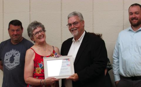 Deyana Simma was presented with an appreciation certificate for her role as the director of the All-American Community Choir that performed during the July 4 event. Photos by DeAnna Maddox
