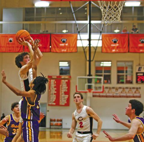 Max Wood puts up a shot in traffic Friday as the Cushing Tigers pick apart the Bristow Pirates 86-28 in front of a homecoming crowd. Cushing advances to 10-6 on the season and will host the Mannford Pirates Friday. Photo by Amber Fausto