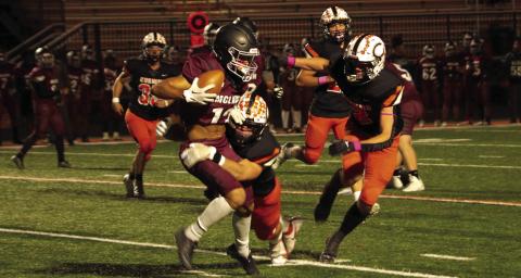 Tiger seniors Riley Matheson and Lane Yaunt bring down a McLain Titan ball carrier during the first half of Cushing’s 63-8 thumping of the Titans. Matheson and Yaunt were part of an impenetrable barrier also known as the Tiger defense Friday. Photo by J. D. Meisner