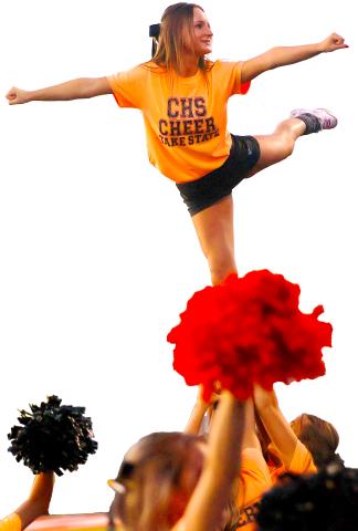 CHS cheerleader Mattie Jones cheers on the Cushing Tigers Friday, as they went on a 41-7 scoring spree in Skiatook. On Saturday the CHS cheer team traveled to Tulsa for State competition and enjoyed their own success, see stories inside this issue. Photo by Sylvia Danielle