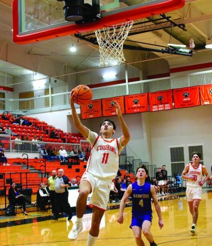 Kanaan Guerrero drains a bucket in transition during the Cushing Tigers defeat of the Mannford Pirates. Guerrero hit the paint hard Friday, scoring 24 points on eight twos and going 8-9 at the free-throw line.