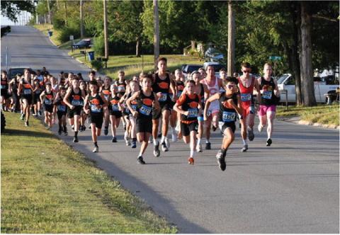 Members of the Cushing Tiger Cross Country team dominate the start of the Grappler’s Gallop Saturday, at Memorial Park. Photo by Sarah Townes