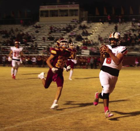 Brody Berlowitz scores on a pass reception from his brother Blaze while Camden Crooks looks on. Photo by J.D. Meisner.