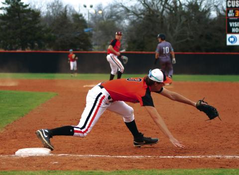 With the ball in the glove and a foot on the base, Cushing’s Ethan Evans makes what should have been an impact-play at first. The umpires saw it the other way and called the Jones runner safe at first.