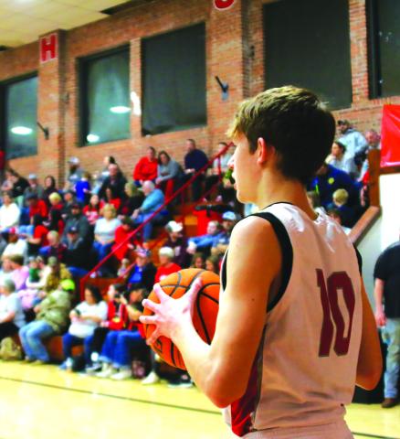Sophomore Tornado Keaton Jensen looks to inbound the ball in front of a packed house during “I Played at the Brick” night last Friday. All Tornado alumni who played at Drumright’s historic arena were invited to be a part of the final high school basketball game to be played in The Brick and they responded, packing the house with a standingroom-only sea of red. Photo by J. D. Meisner