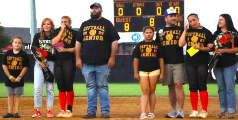 Emotions overcome CHS senior softball players Gracyn Presley and Faith Kesler as they stand on the infield with their families during senior night recognition last week. Photo by Sylvia Danyele