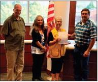 Cushing Lions Club: Pictured left to right – Commissioner Chris Reding, D2; Commissioner Rhonda Markum, D3; Lou Griffin, Cushing Lions Club; Commissioner Zach Cavett, D1 and Chairman.