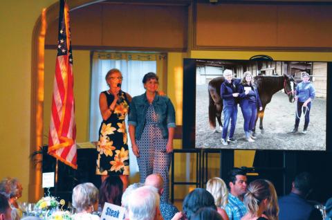 Leslie Kirkland stands hand in hand with Julie Jones as she thanks her for putting in so much time and effort into her work at The Right Path and in coordinating the 25th Anniversary Fundraiser Gala on Saturday, July 24.