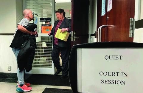 Virginia Banks is shown during an encounter with an unidentified person at the Payne County courthouse. Photo by Elizabeth Caldwell, Oklahoma Watch