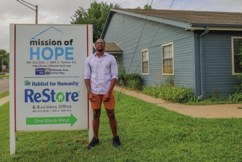 Gipson stands outside the Mission of Hope organization that once helped him so fully and that is now facing a funding crisis and asking for community support to stay operational.