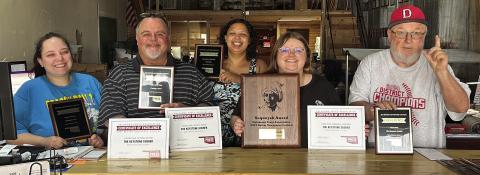 The staff at Cimarron Valley Communications show off some of the hardware they brought home from the Oklahoma Press Association Convention this past weekend. Pictured are, Business Manager and Layout Artist Sapphire Smith, Publisher J. D. Meisner, Lead Reporter DeAnna Maddox, Group Editor Allie Prater and Sports Analyst Robert “Tornado Watch” Marshall. Photo by Raynee Howell