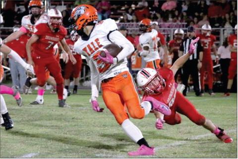 Caymon Prather jukes past a Tornado defender. Photo by Allie Prater