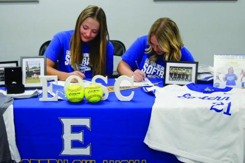 Ripley Lady Warrior softball players Taylor Boyd and Dakota Hall sign their letters of intent to play softball for Eastern Oklahoma State College in Wilburton, Thursday Nov. 9.