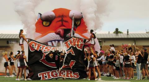 Tiger running back Cole Cooper breaks the seal on the 2024-25 football season during the Tiger runout prior to Cushing’s 18-7 win over Berryhill. Photos by J. D. Meisner